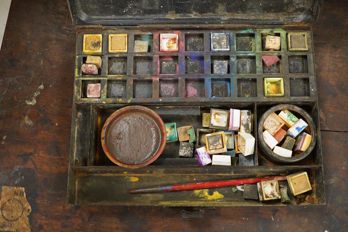 Three early to mid 20th century artist’s paint boxes, one tin box with Winsor and Newton label to the inside of the lid, plus a Rowley labelled box, a wooden paint box- 39cm wide, together with a leather pencil case, the